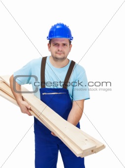 Worker carrying wooden plancks