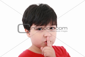 shh. secret - Young boy with his finger over his mouth 