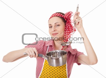 Playful housewife with ladle and pan