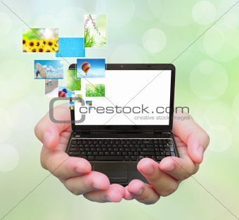 laptop PC and streaming images virtual buttons on women hand