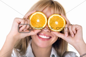 Portrait of the funny smiling girl with oranges. Isolated