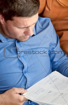 Businessman analyzing a sheet