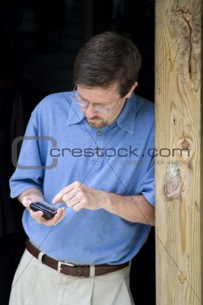 Business Man Working on Cellular Phone