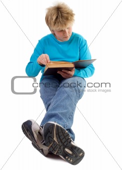 teenager boy reading a book