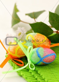 The Easter composition eggs,  green grass over white