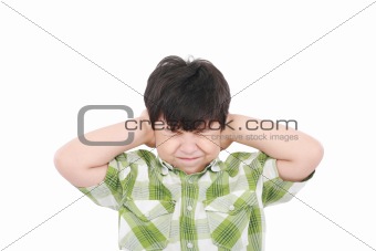 Little boy closing his eyes and ears with his hands, isolated on