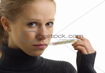 Sick woman holding thermometer