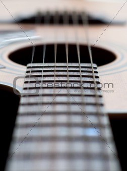 Close-up of a guitar neck with all strings