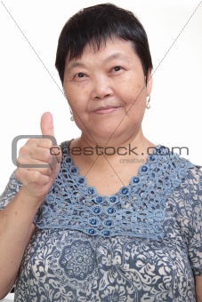 Happy Asian young woman give you an excellent gesture with friendly smiling face
