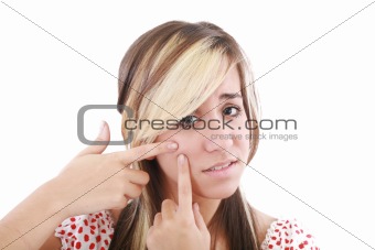 Acne facial care, teenage girl squeezing pimple  