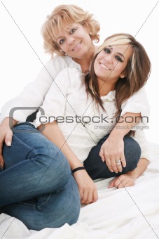 image of a mother and daughter happily together sitting on the f