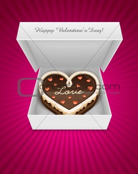 open box with chocolate cake in heart form