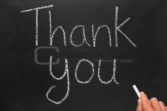 Writing thank you on a blackboard.