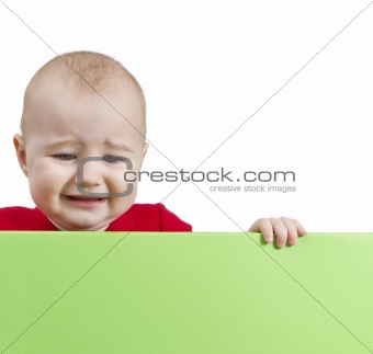 sad young child holding shield