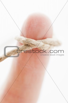 Finger with string tied around