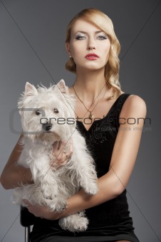 old fashion blond girl, with dog she looks in to the lens