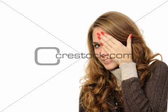 girl is gazing through her fingers 