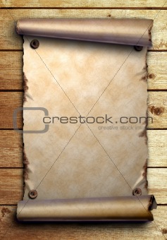 Scroll of old paper on wooden boards    
