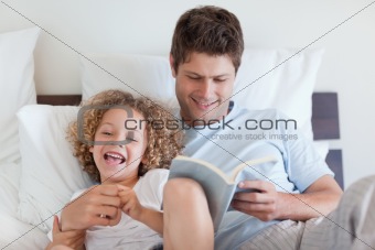Father reading bedtime story for child