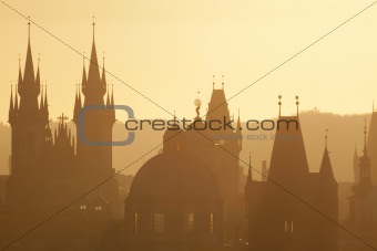 czech republic, prague - spires of the old town and tyn church on misty morning