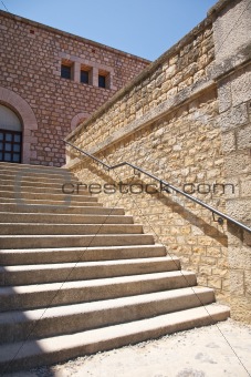 stone stairs with metal banister