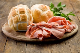 Mortadella with Bread on Chopping board