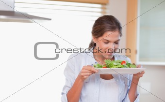 Woman smelling a salad