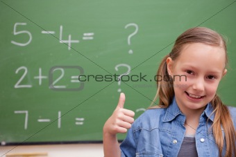 Schoolgirl with the thumb up