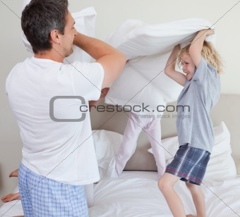 Family having a pillow fight
