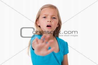Unhappy girl saying stop with her hand