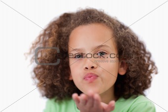 Close up of a girl blowing a kiss