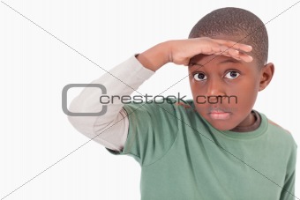 Boy putting his hand on his forehead