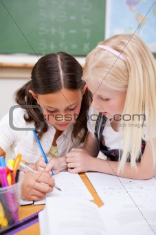 Portrait of pupils working together on an assignment