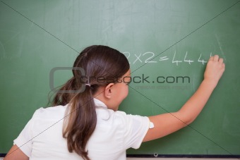 Schoolgirl writing numbers