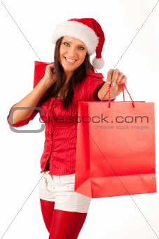 beautiful girl dressed like Santa with Christmas presents 