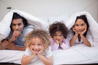 Family playing in the bedroom