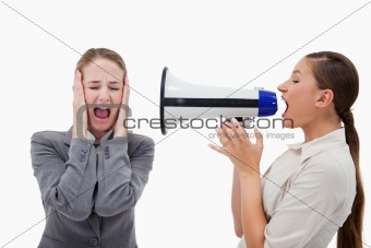 Manager yelling at her colleague through a megaphone