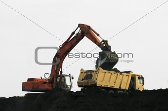 Excavator loading truck