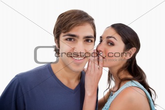 Young woman whispering something to her fiance