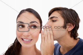 Man whispering something to his fiance