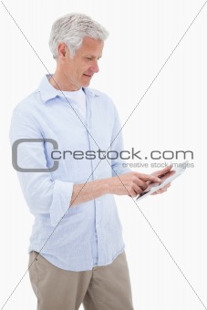 Portrait of a mature man using a tablet computer