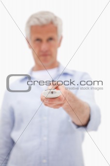 Portrait of a man using a remote