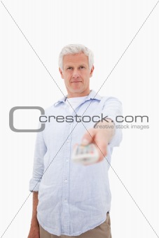 Portrait of a mature man switching of channel