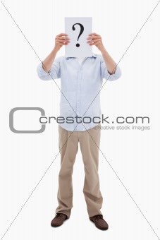 Portrait of a man holding a question mark on a paper
