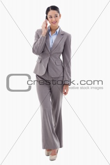 Portrait of a brunette businesswoman making a phone call
