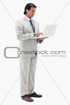 Portrait of a businessman using a notebook