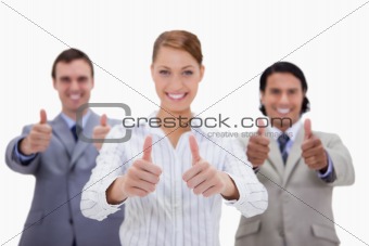 Businessteam giving thumbs up