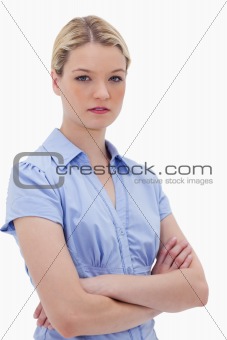 Woman standing with arms folded