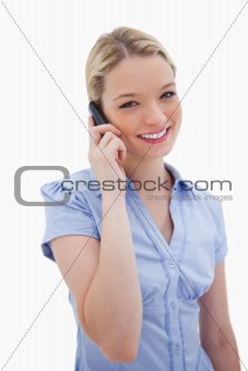 Smiling woman using cellphone