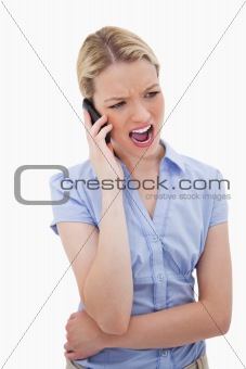 Woman yelling into her phone